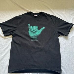Black heavyweight cotton T-Shirt with Shaka Green Graphic.
